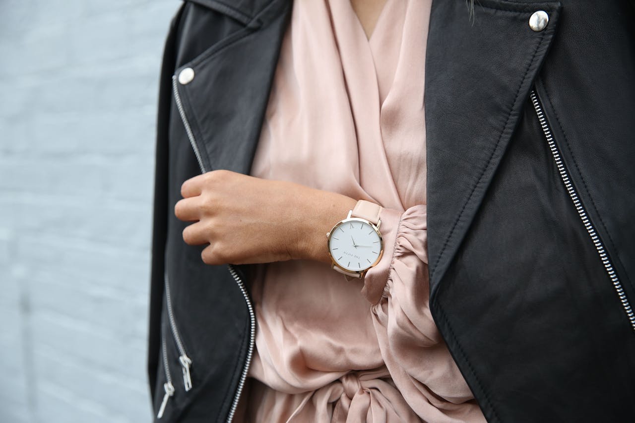 services-03 Stylish woman in a leather jacket showcasing an elegant wristwatch, perfect for fashion-forward individuals.